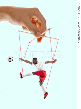 Man like a puppet in somebodies hands. Concept of manipulation Man like a puppet in somebodies hands. Concept of manipulation 55112072