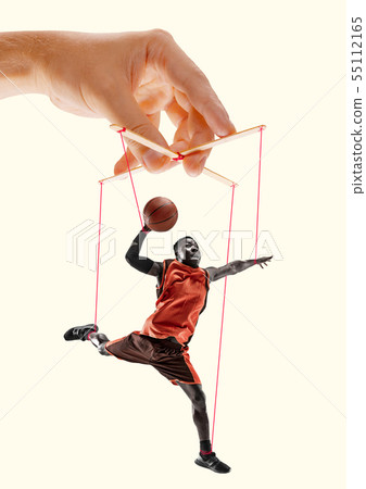Man like a puppet in somebodies hands. Concept of manipulation Man like a puppet in somebodies hands. Concept of manipulation 55112165
