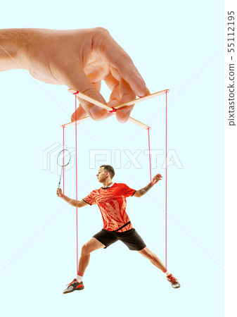 Man like a puppet in somebodies hands. Concept of manipulation Man like a puppet in somebodies hands. Concept of manipulation 55112195