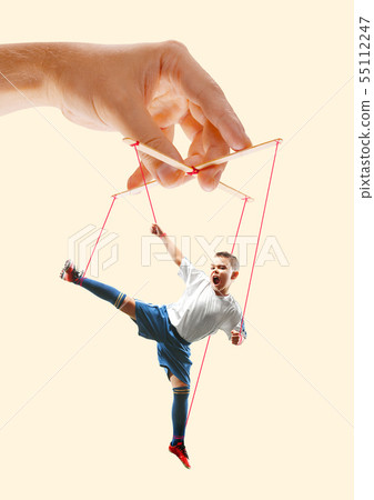 Man like a puppet in somebodies hands. Concept of manipulation Man like a puppet in somebodies hands. Concept of manipulation 55112247