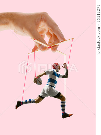 Man like a puppet in somebodies hands. Concept of manipulation Man like a puppet in somebodies hands. Concept of manipulation 55112273