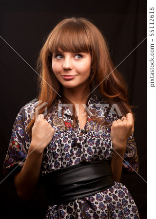 Beautiful young woman with red hair Beautiful young woman with red hair 55112618