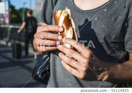 man eating a german ham sandwich man eating a german ham sandwich 55114935