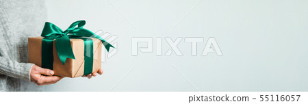 Female hands hold gift box, copy space right Female hands hold gift box, copy space right 55116057