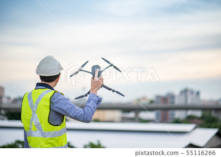 Asian engineer man using drone for site survey Asian engineer man using drone for site survey 55116266