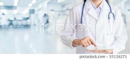Doctor hand touching on tablet computer in 55116271