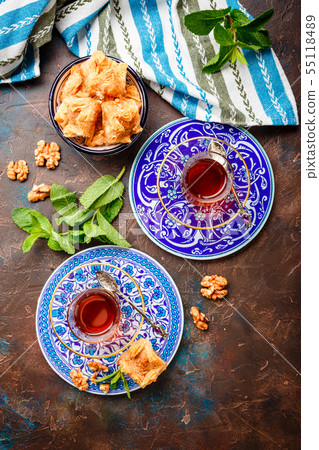 Traditional Turkish arabic dessert and a glass of 55118489