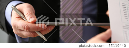 Businessmen and woman look and study statistics 55119440