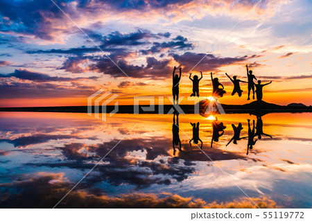 Father mother beach evening scene silhouette 55119772