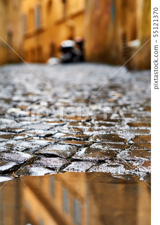 Cobblestone brick paved street in Rome Cobblestone brick paved street in Rome 55121370
