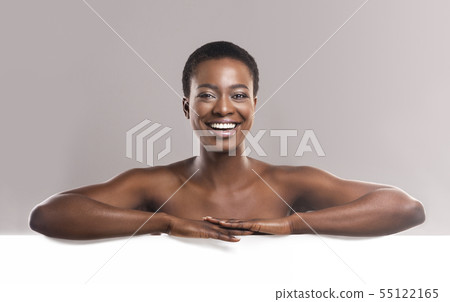 Nude african american man leaning at white blank board 55122165