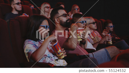 Family eating popcorn in cinema Family eating popcorn in cinema 55124532