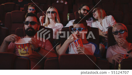 Parents covering theirs childrens eyes in cinema Parents covering theirs childrens eyes in cinema 55124707