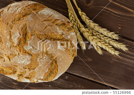 Rye wheat bread on brown wood 55126998