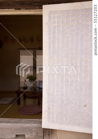 A room in a Hanok with a window screen A room in a Hanok with a window screen 55127203