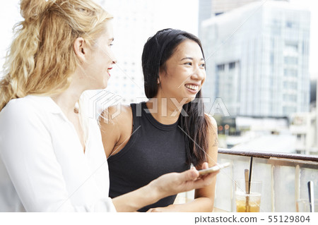 Pretty women in cafe 55129804