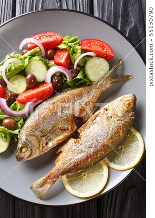 Delicious fried salpa fish with fresh vegetable Delicious fried salpa fish with fresh vegetable 55130790