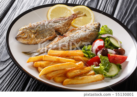 Traditional fried Sarpa salpa fish with lemon and Traditional fried Sarpa salpa fish with lemon and 55130801