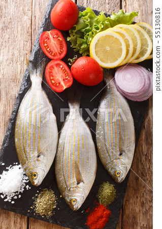 Freshly caught Sarpa salpa with raw vegetables and Freshly caught Sarpa salpa with raw vegetables and 55130816