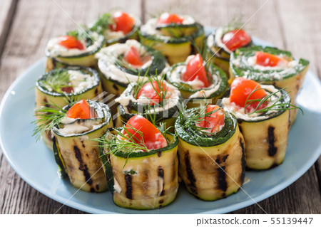 Zucchini rolls with cream cheese , tomatoes and Zucchini rolls with cream cheese , tomatoes and 55139447