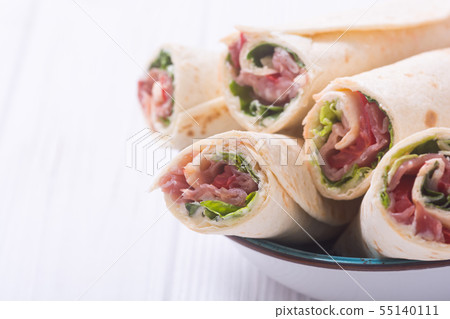 Sliced sandwich tortilla with vegetables and ham 55140111