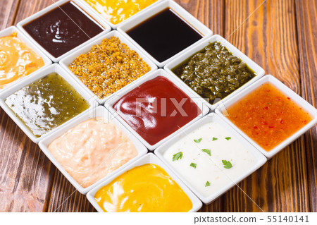 Set of different sauces in ceramic bowl 55140141