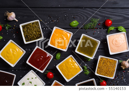 Set of different sauces in ceramic bowl 55140153