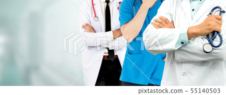 Doctor working in hospital with other doctors. Doctor working in hospital with other doctors. 55140503