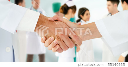Doctor working in hospital with other doctors. 55140635