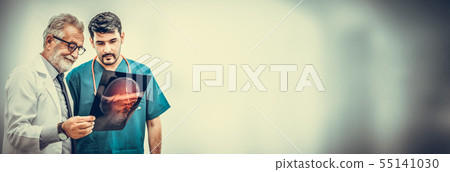 Doctors at hospital working with another doctor. 55141030