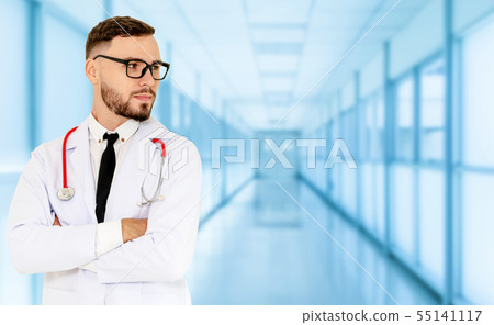 Young male doctor working at the hospital. 55141117