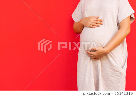 Happy pregnant woman and expecting baby at home. Happy pregnant woman and expecting baby at home. 55141319