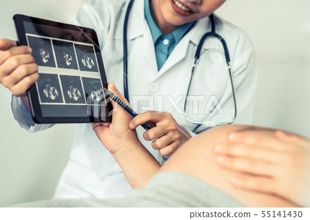 Pregnant Woman and Gynecologist Doctor at Hospital Pregnant Woman and Gynecologist Doctor at Hospital 55141430