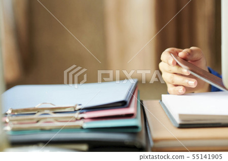 Woman opening planner 55141905