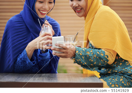 Pretty muslim women taking selfie 55141929