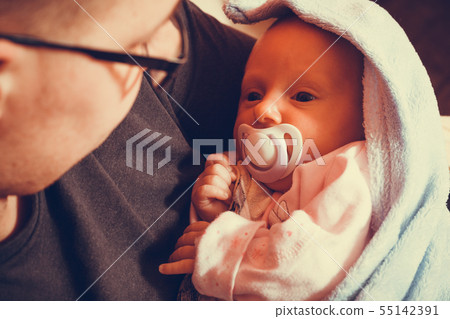 Father holding taking care of newborn baby Father holding taking care of newborn baby 55142391
