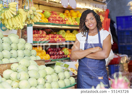Cheerful woman working in supermarket Cheerful woman working in supermarket 55143726