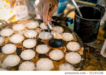 "Kanom Krok" is Thai traditional dessert. Woman  55145196