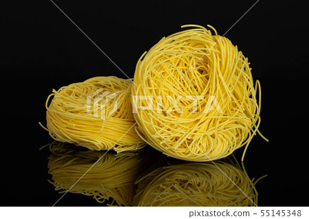Angel hair pasta isolated on black glass Angel hair pasta isolated on black glass 55145348