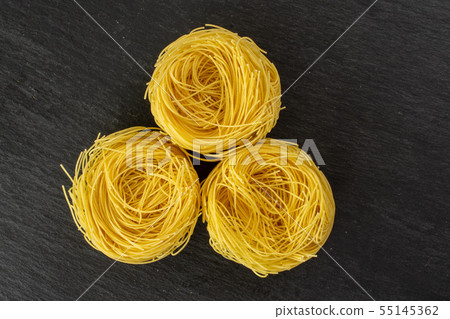 Angel hair pasta on grey stone 55145362