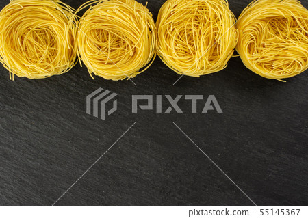 Angel hair pasta on grey stone Angel hair pasta on grey stone 55145367