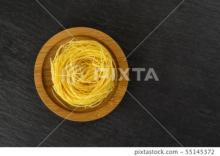 Angel hair pasta on grey stone 55145372