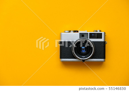 Retro Film Camera on yellow background.  55146830