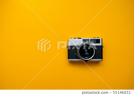 Retro Film Camera on yellow background.  55146831