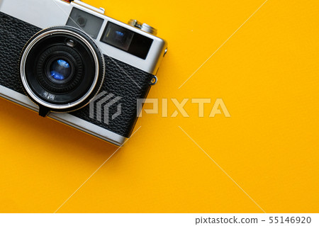 Retro Film Camera on yellow background.  55146920