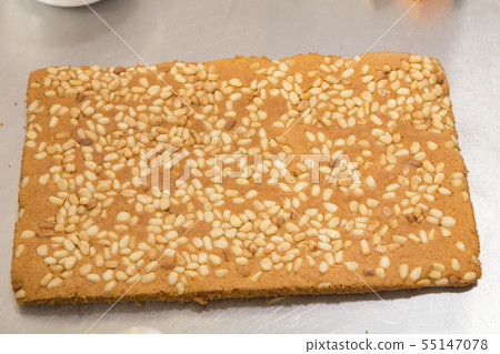 Ready carrot sponge cake with pine nuts. 55147078