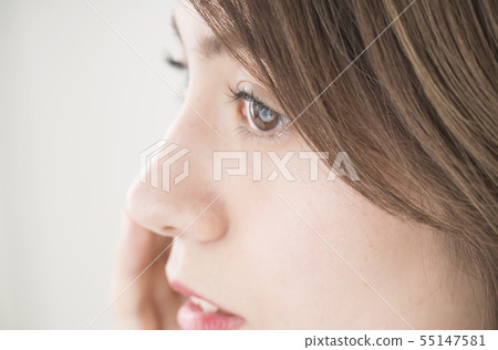Young woman stares Young woman stares 55147581