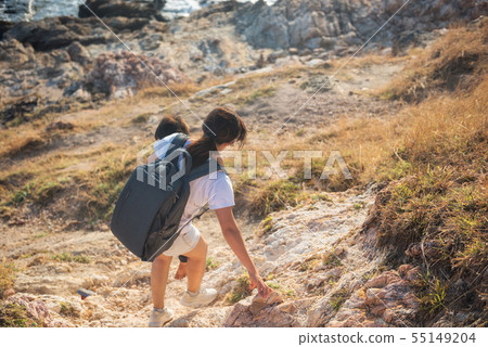 mother holding son to hiking downhill 55149204