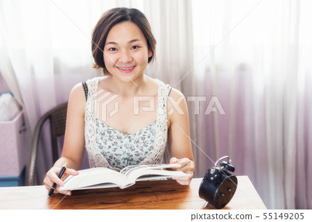 Asian female student read book for final exam 55149205
