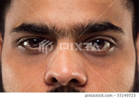Close up portrait of young man on blue background. Close up portrait of young man on blue background. 55149723